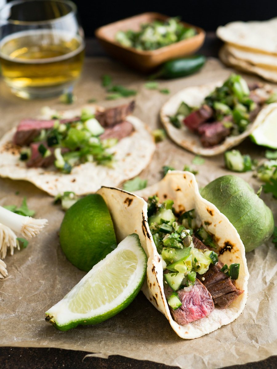 Carne asada tacos with salsa verde and lime